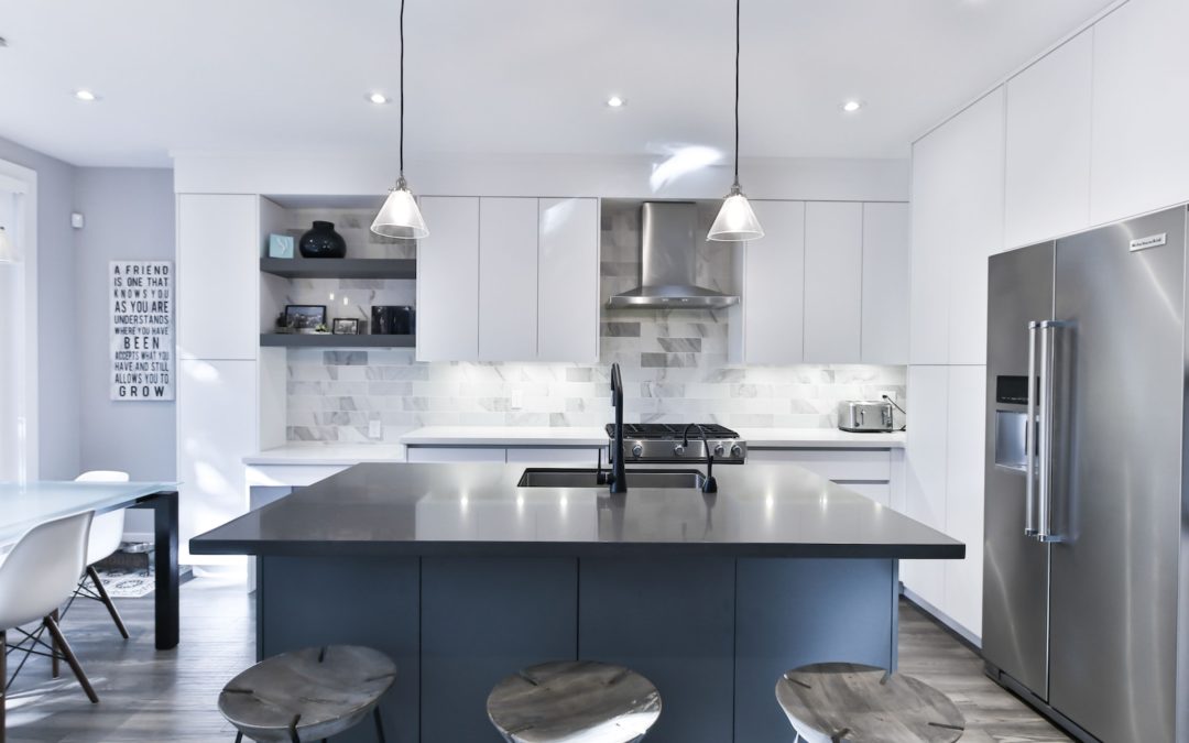 a kitchen with a center island with stools