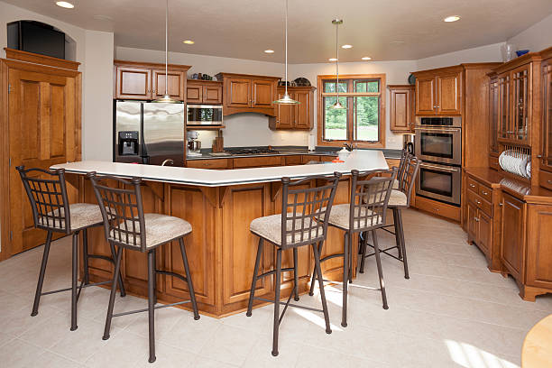 Dine-In Kitchen With Hardwood Cabinetry Cuisiniste à Bry sur Marne