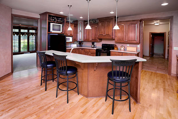 "Dine-In Kitchen Interior Design, Hardwood Floor, Cabinets, Custom Lighting." Cuisiniste à Bry sur Marne